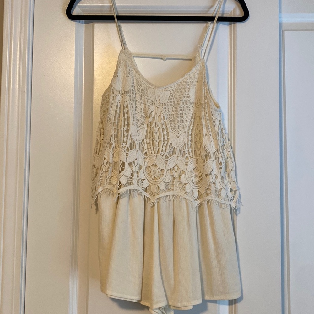 Off white American Eagle romper with cute overlay detail. XS.